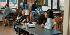 Recruiter speaking to potential candidate in office setting