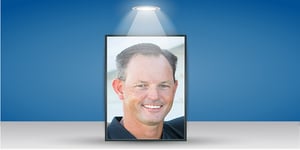 Headshot of man with spotlight 