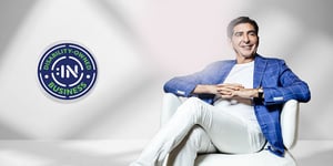 Harley Lippman sitting in white pants and blue blazer