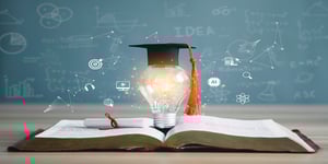 graduation cap lightbulb on book icon