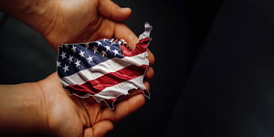 male hands holding flag united states of america