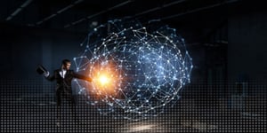 Magician pointing at glowing orb in technology bubble on top of black background