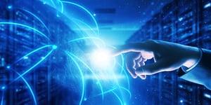 Finger pointing at glowing blue light