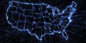 Glowing blue outline of the United States of America on black background