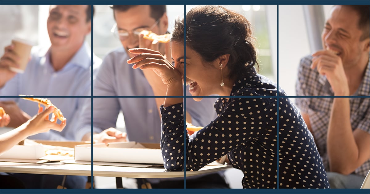 A woman laughing with her colleagues while enjoying some pizza for lunch