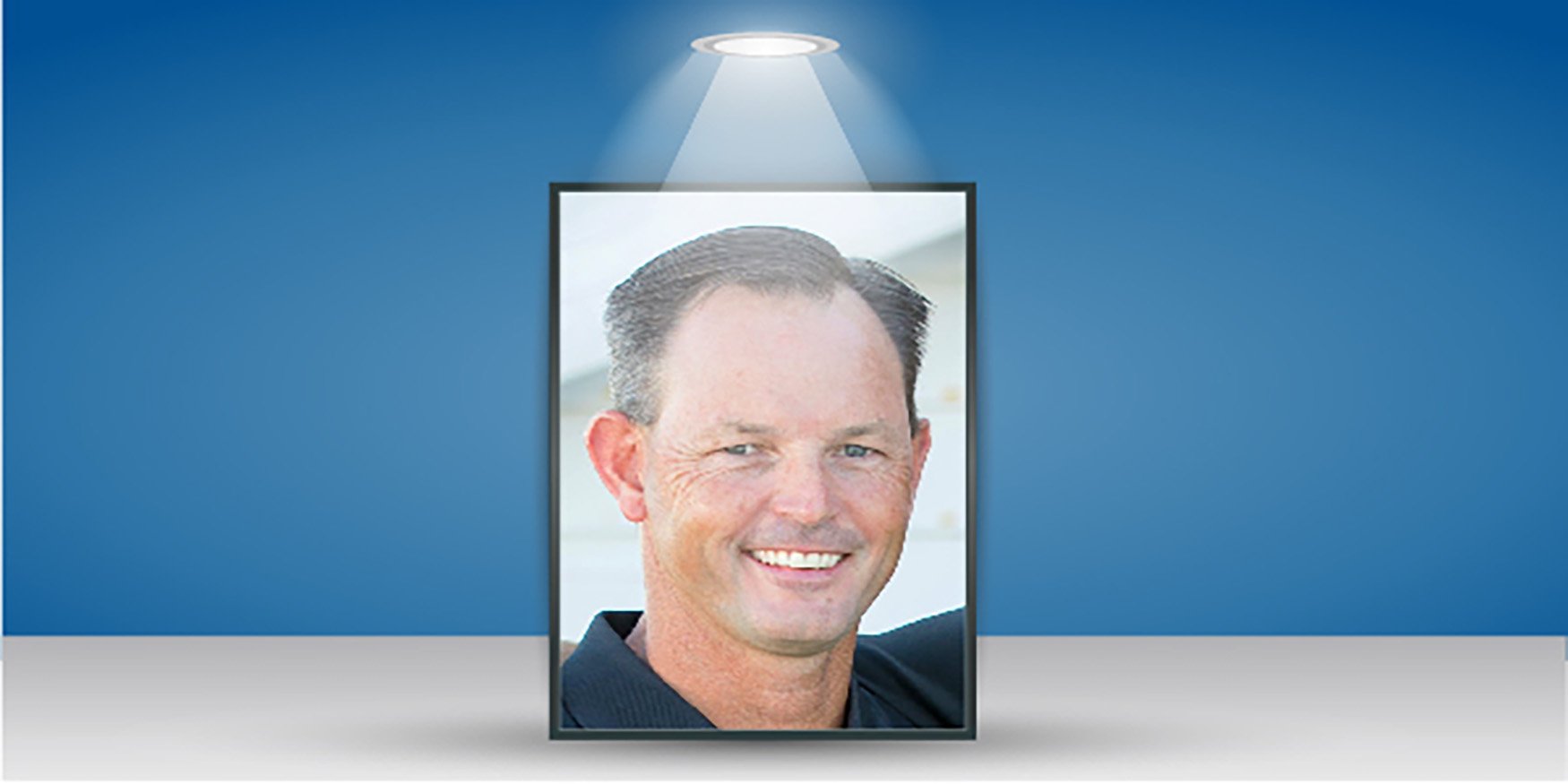 Headshot of man with spotlight 