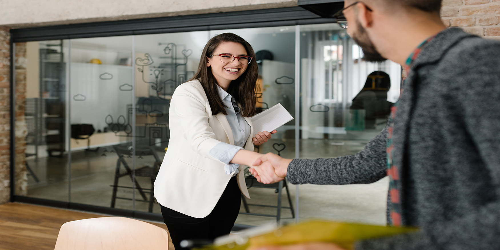 Woman greeting job recruiter firm handshake smiling