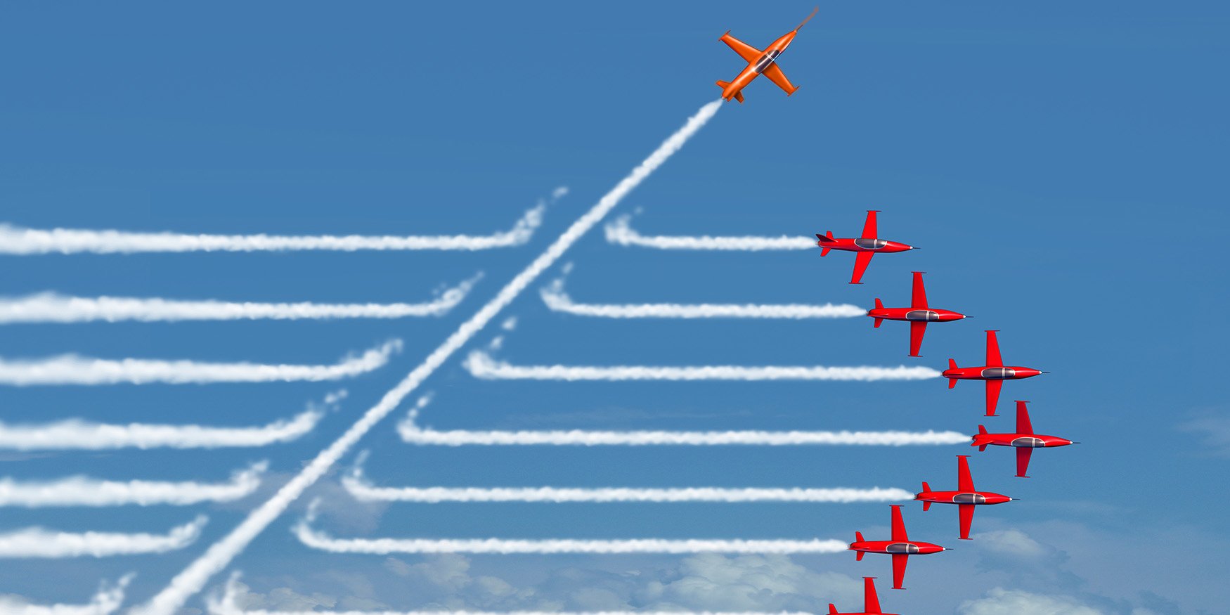 Red airplanes in the sky one going in a different direction