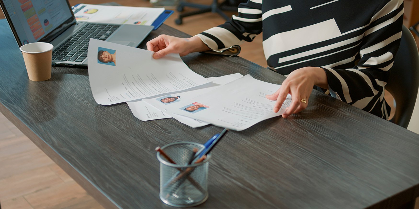 Recruiter sorting through resumes